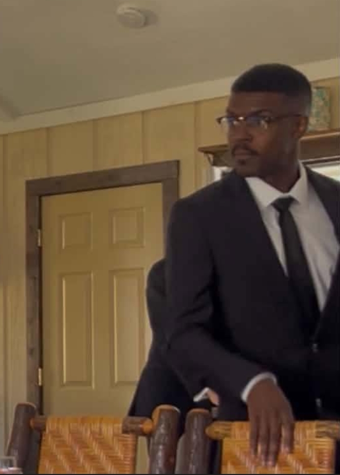 Rick Magnus Rose in a suit on a film set